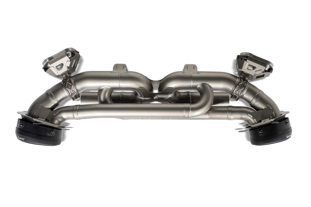 Akrapovič Porsche 992.1 Carrera GTS Dakar Slip-On Race Exhaust system installed on a sports car, showcasing the high-performance exhaust.