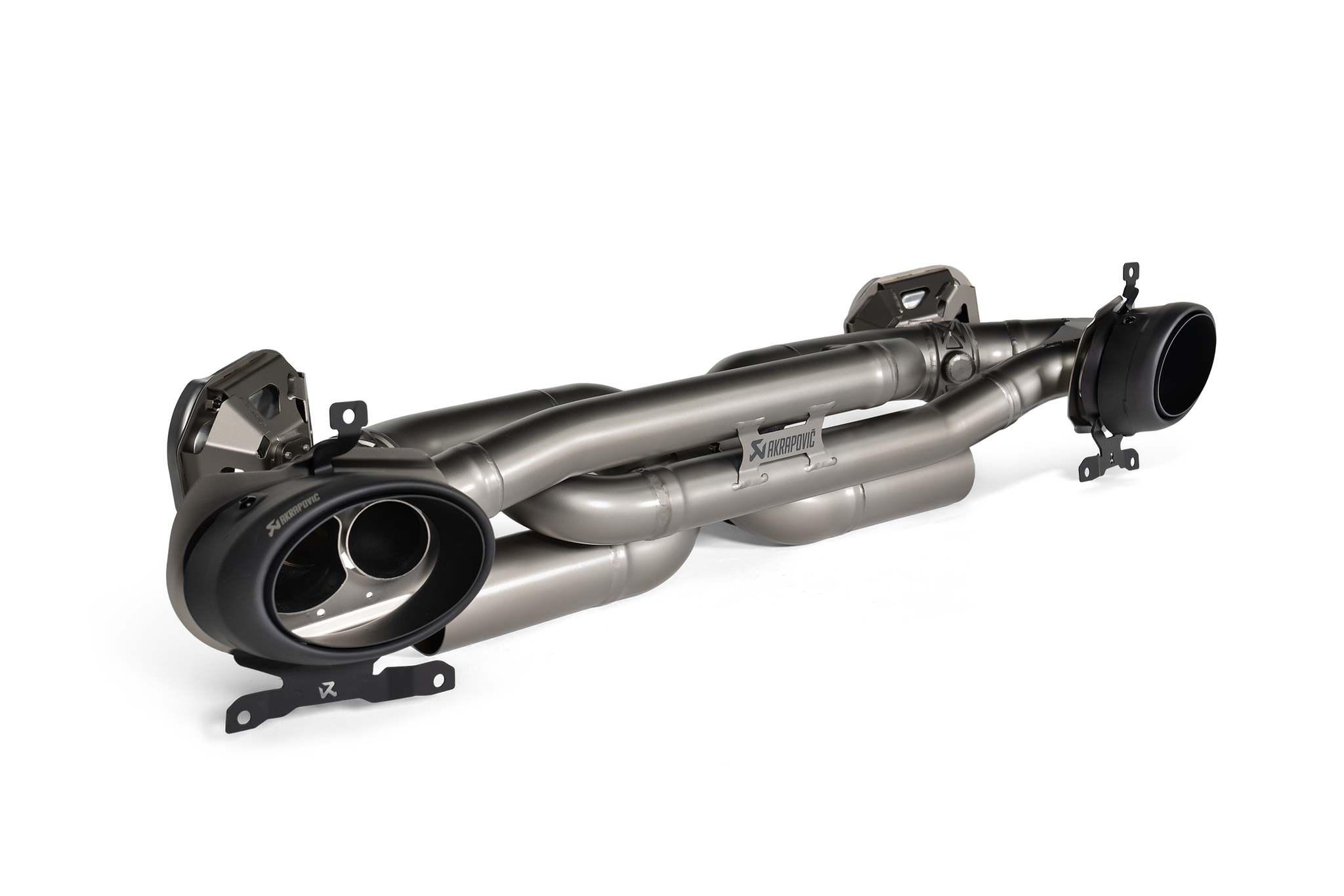 Akrapovič Porsche 992.1 Carrera GTS Dakar Slip-On Race Exhaust, black titanium finish, mounted on vehicle engine bay.