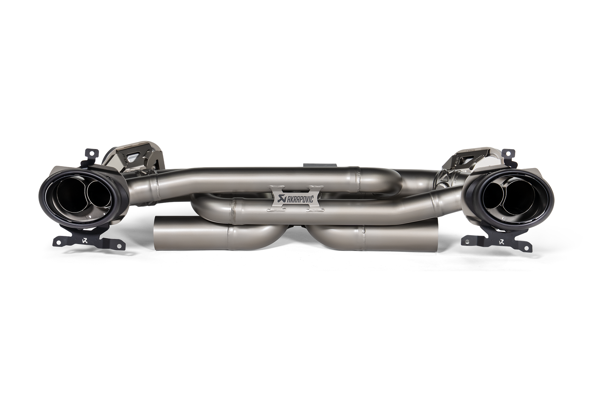 Akrapovič Porsche 992.1 Carrera GTS Dakar Slip-On Race Exhaust showing sleek black carbon fiber finish and polished exhaust tips.