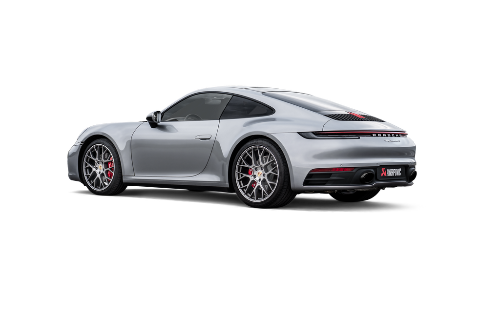 Akrapovič titanium slip-on race exhaust installed on a Porsche 992.1 Carrera, GTS, or Dakar model, showcasing the exhaust detail.