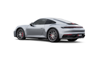 Akrapovič titanium slip-on race exhaust installed on a Porsche 992.1 Carrera, GTS, or Dakar model, showcasing the exhaust detail.
