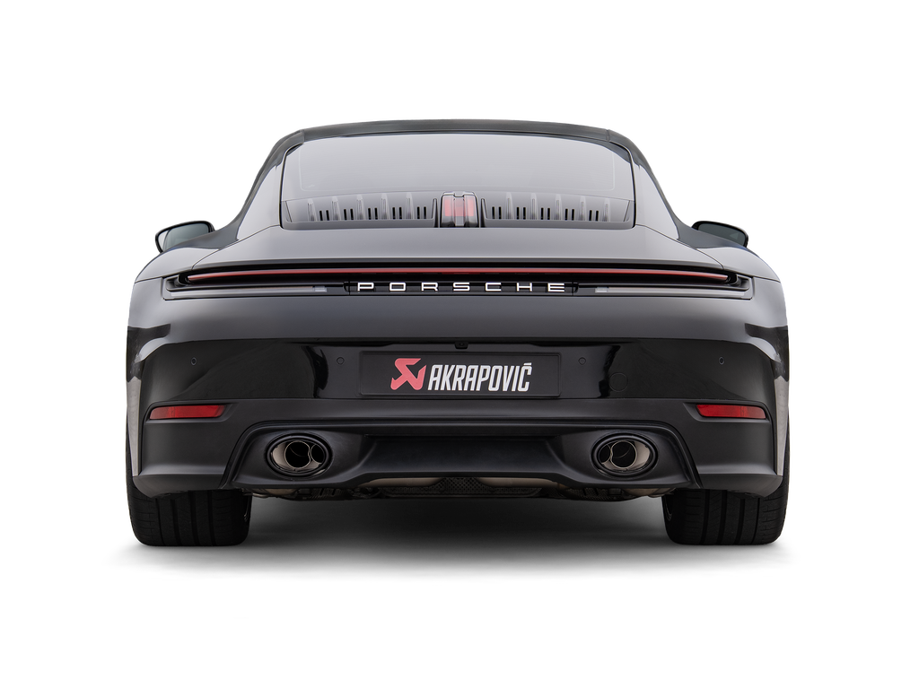 Akrapovič Porsche 992.2 Carrera T slip-on exhaust system installed on the rear of the vehicle, showing the sleek exhaust tips.