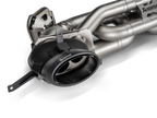 Akrapovič Porsche 992.2 Carrera T Slip-On Line exhaust system components, showcasing stainless steel pipes and muffler details.