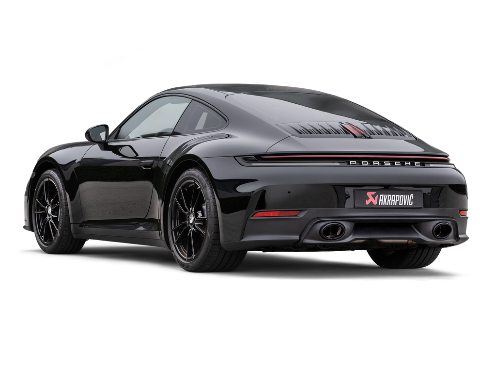 Akrapovič Porsche 992.2 Carrera T slip-on exhaust system with valve, showcasing polished metal and branding details.