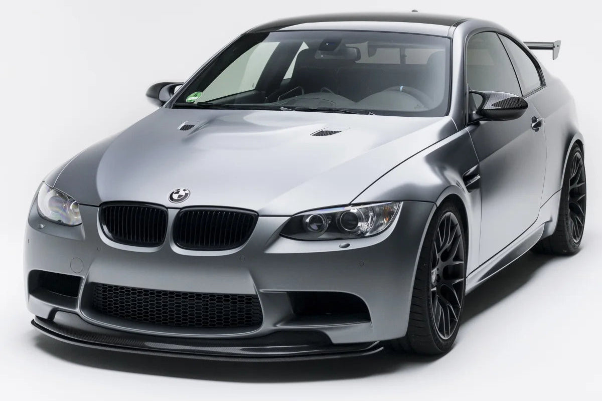 Alpha N E9X M3 GTS front lip installed on a BMW, showcasing its sleek design and adjustable splitter features.