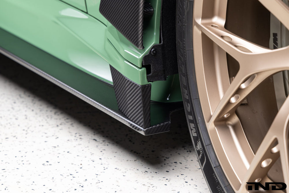 Alpha-N carbon fiber full replacement side skirts installed on a BMW G87 M2.