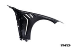 Alpha N G8X M3 M4 carbon vented front fender set installed on white background, showcasing exterior automotive body parts.