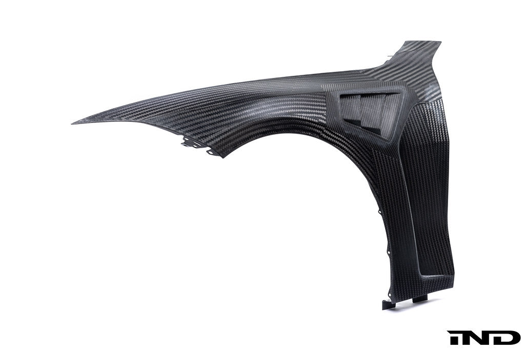 Alpha N BMW G8X M3 M4 carbon vented front fender set installed on white background, showcasing exterior car customization.