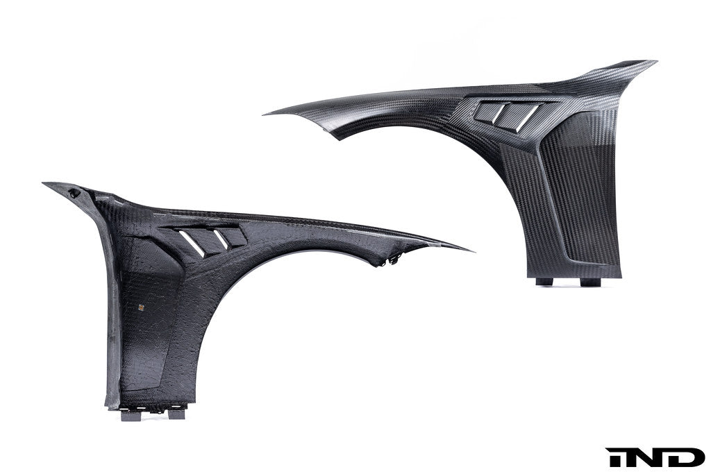 Alpha N G8X M3 M4 carbon vented front fender set for BMW, showcasing sleek exterior design on a white background.