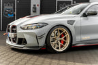 Alpha N G8X M3 M4 carbon vented front fenders installed on a BMW G8X M3 M4 exterior vehicle.