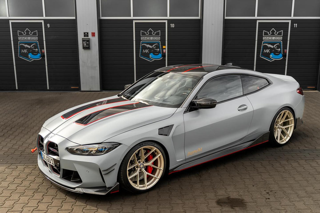 Alpha N G8X M3 M4 carbon vented front fenders installed on a BMW G8X M3 M4 exterior upgrade.