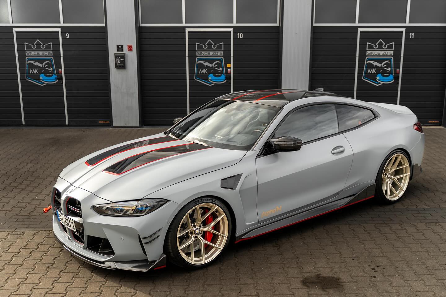 Alpha N G8X M3 M4 carbon vented front fenders installed on a BMW G8X M3 M4 exterior upgrade.