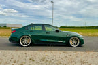Alpha N G8X M3 M4 carbon vented front fenders installed on a BMW G8X M3 M4 exterior car part.
