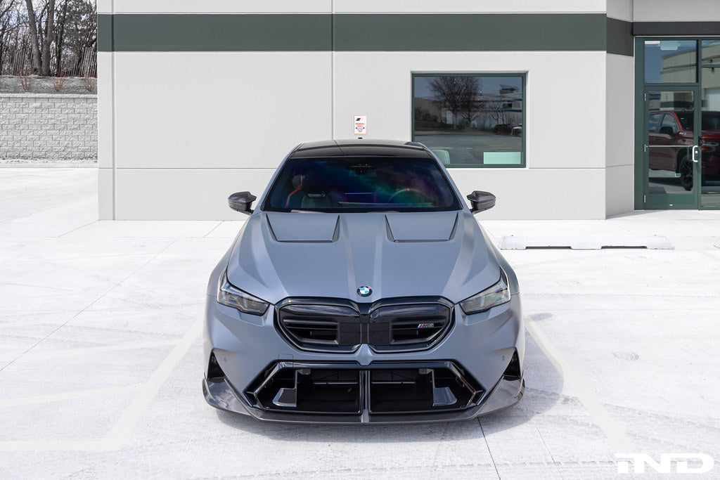 Alpha N BMW G90 G99 M5 carbon front splitter set installed, 3-piece exterior kit enhancing aerodynamics and sporty look.
