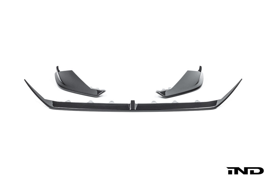 Alpha N G90 G99 M5 carbon front splitter set, 3-piece exterior upgrade, shown in white on a BMW vehicle.