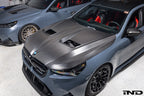 Alpha N BMW G90 G99 M5 with carbon vented hood installed, showcasing the sleek exterior design and sporty hood details.