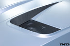 Alpha N BMW G90 G99 M5 carbon vented hood installed on exterior of vehicle, showcasing lightweight performance and sleek design.