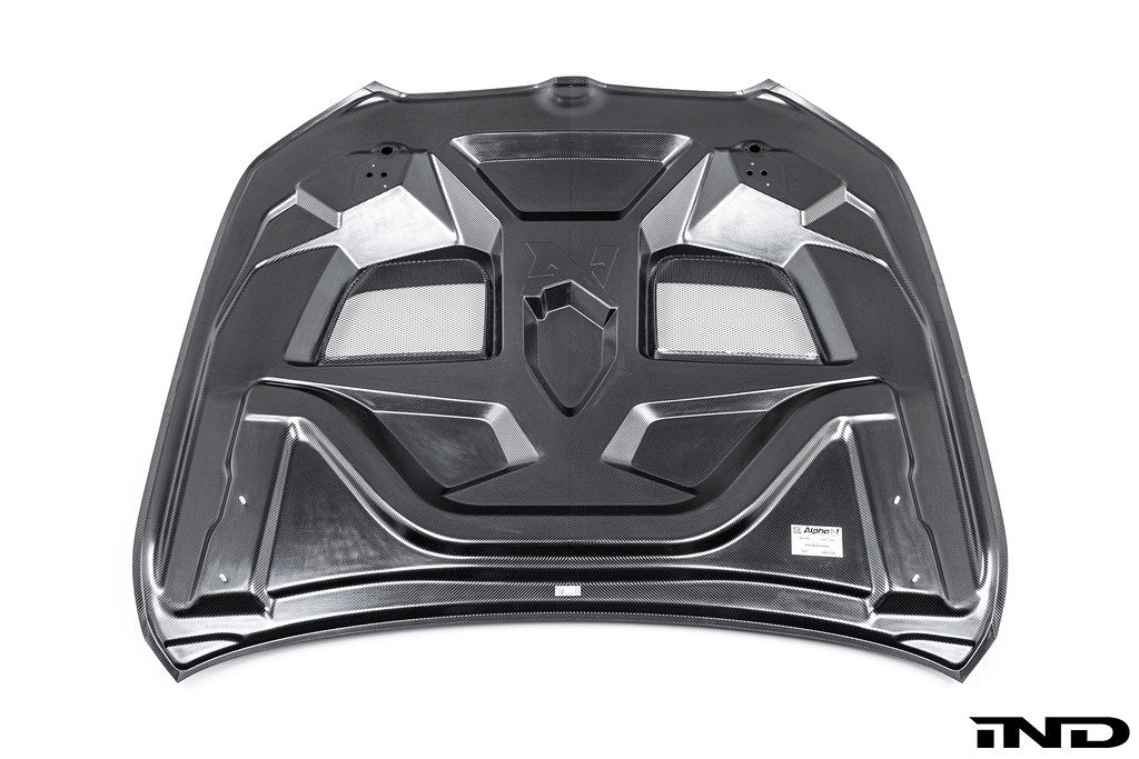 Alpha N BMW G90 G99 M5 carbon vented hood, exterior view showing lightweight black carbon design on white background.