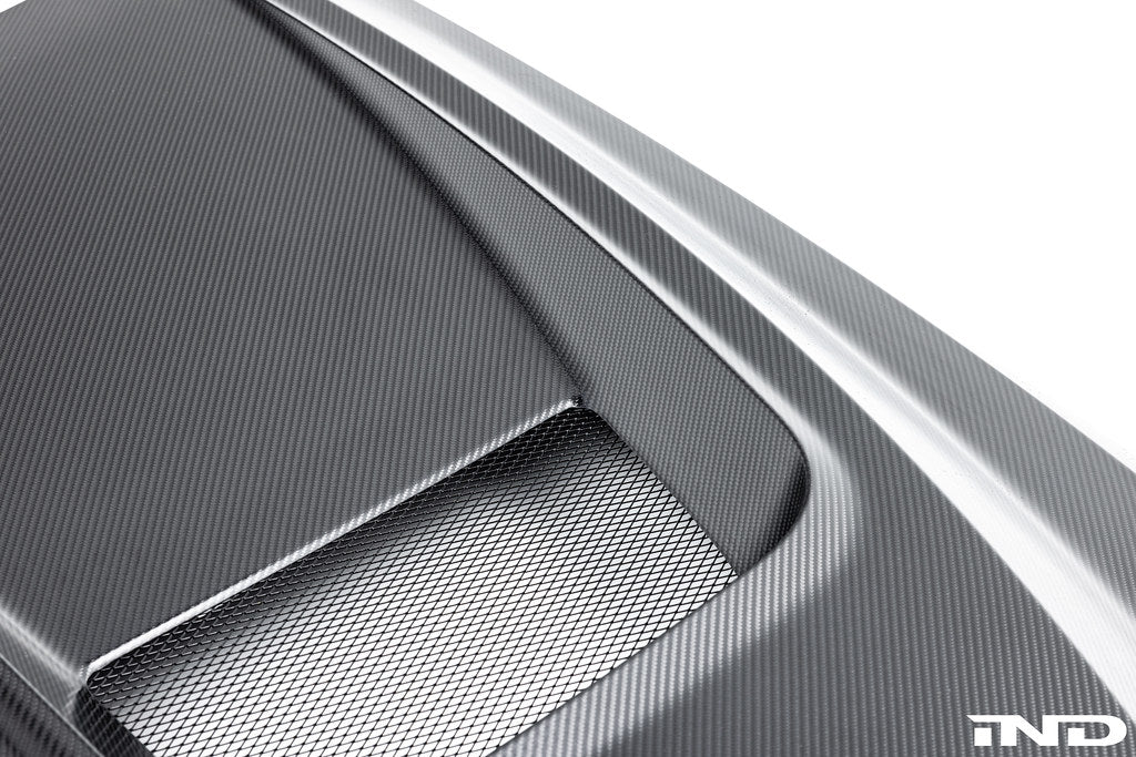 Alpha N BMW G90 G99 M5 carbon vented hood with aerodynamic vents, shown on a white background.