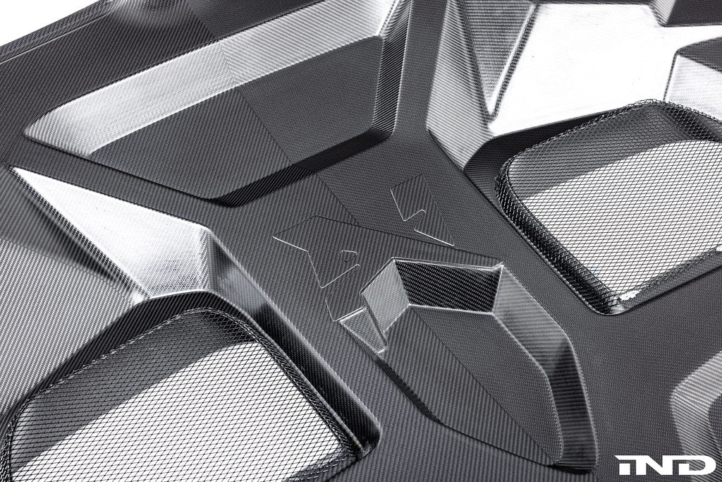 Alpha N BMW G90 G99 M5 carbon vented hood with aerodynamic vents, shown on a white background.