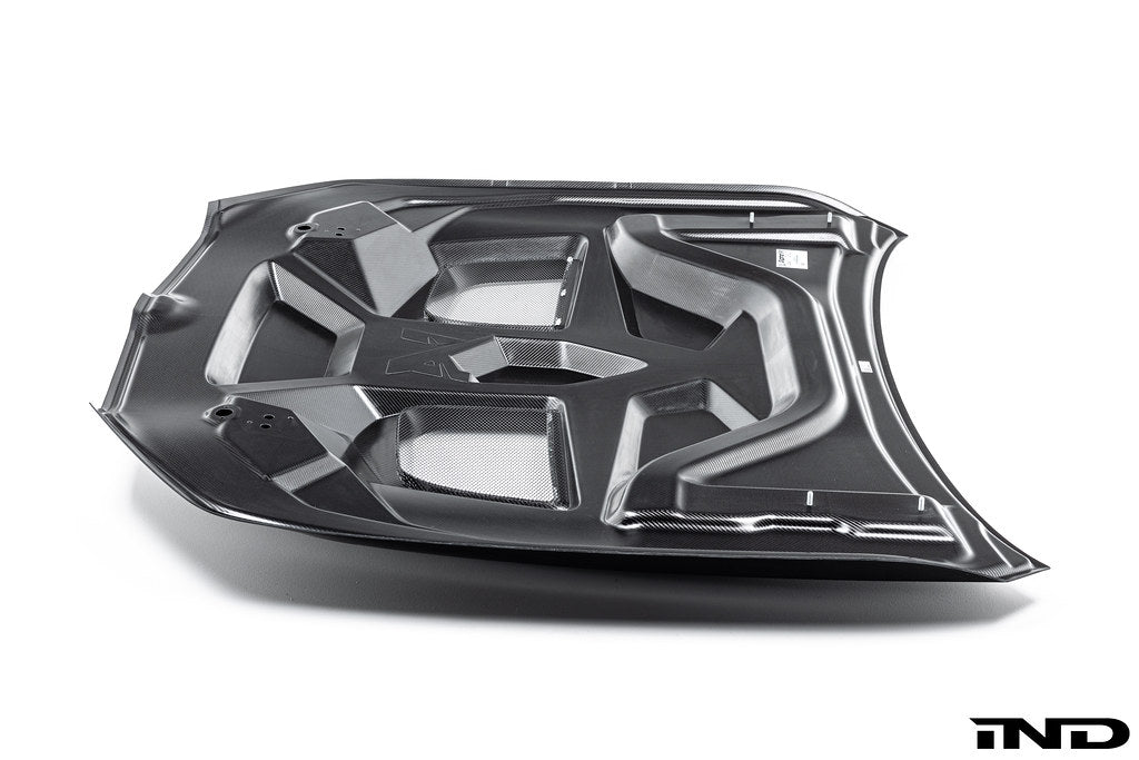 BMW G90 G99 M5 carbon vented hood by Alpha N, showcasing the sleek white exterior with vented design and high-performance craftsmanship.