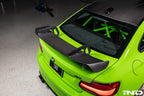 Alpha N Alpha-N Carbon SN rear wing installed on a vehicle, showcasing its sleek exterior design and aerodynamic features.