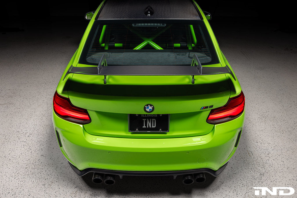 Alpha N Alpha-N Carbon SN rear wing installed on a vehicle, showcasing its sleek exterior design and aerodynamic features.