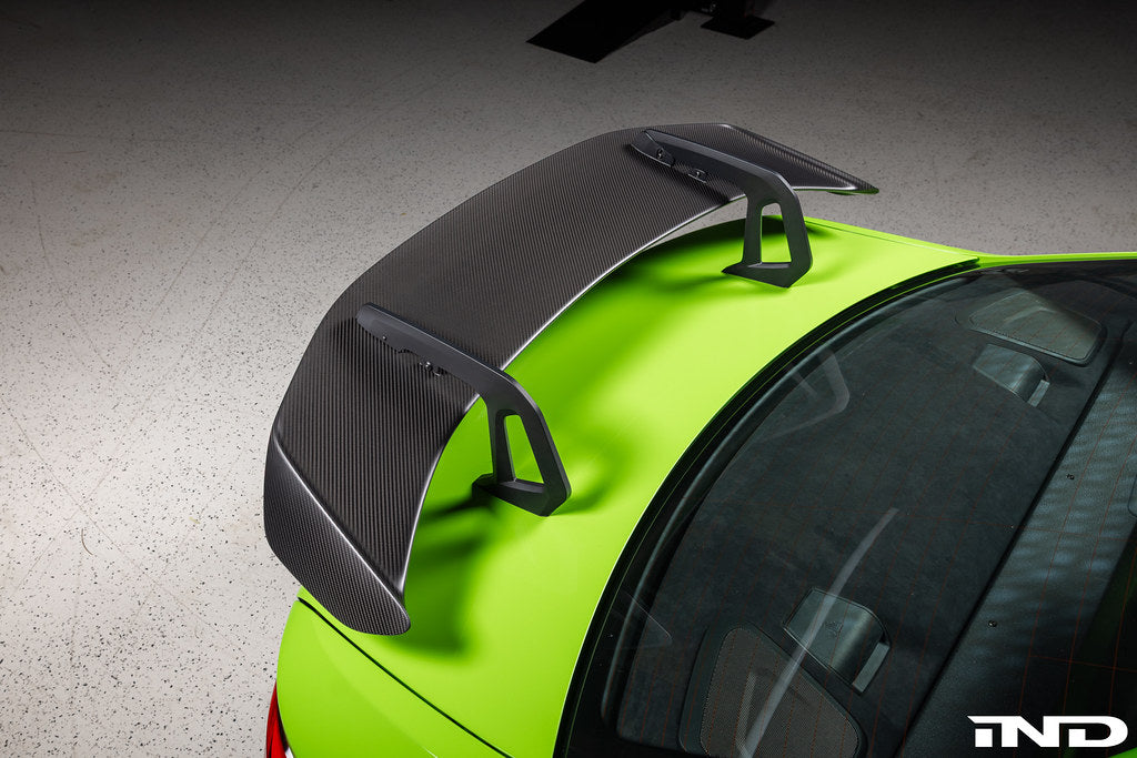 Alpha N Alpha-N Carbon SN rear wing installed on a car, showcasing its sleek exterior design and aerodynamic features.