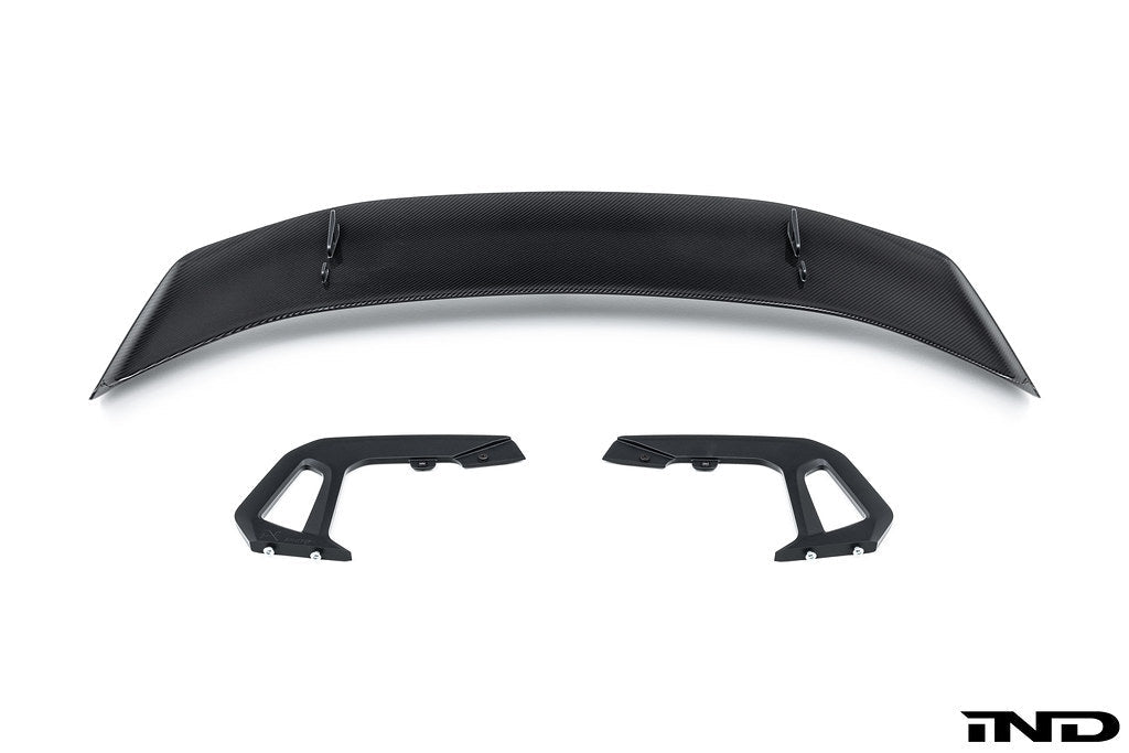 Alpha-N Carbon SN rear wing mounted on a car, showcasing its aerodynamic exterior design on a white background.