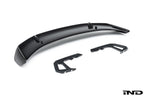 Alpha N Alpha-N Carbon SN rear wing mounted on a car, showcasing sleek white exterior design and aerodynamic features.