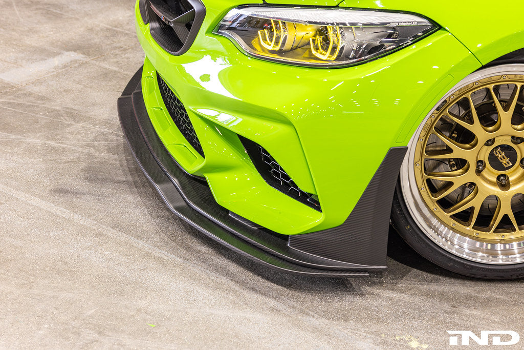 Alpha N carbon Corse front splitter installed on BMW M2 Competition F87, enhancing aerodynamics and sporty exterior appearance.
