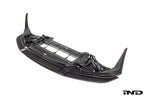 Alpha N F87 M2 Competition CS Carbon Corse front splitter mounted on a white background, showcasing its aerodynamic design and carbon fiber finish.
