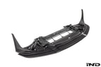 Alpha N F87 M2 Competition CS Carbon Corse front splitter installed on a white background, showcasing its aerodynamic design.
