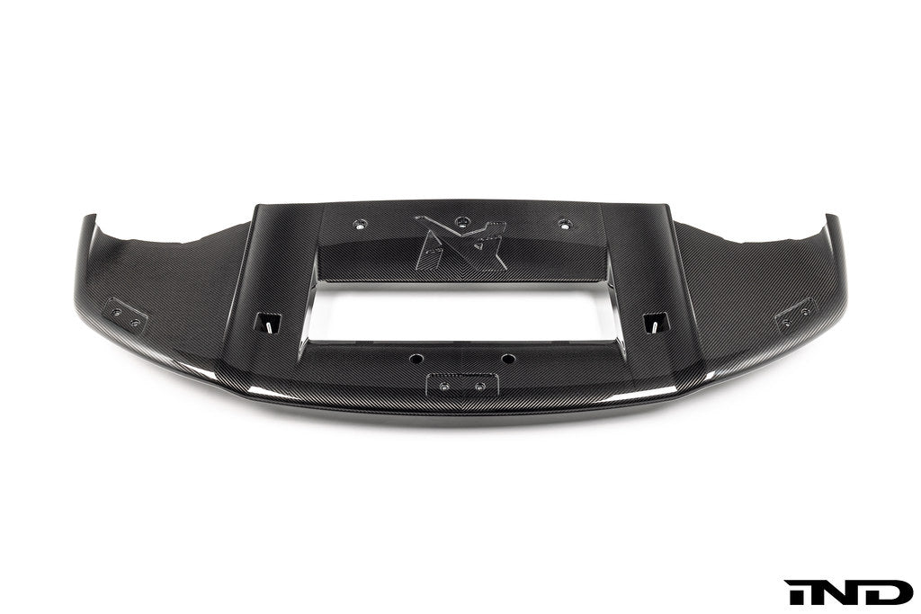 Alpha N G87 M2 Carbon Corse front splitter mounted on a vehicle, designed for aerodynamic performance and a sporty look.