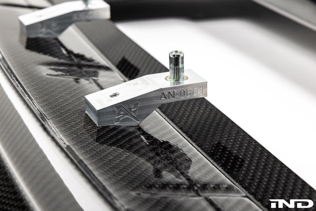 Alpha N G87 M2 Carbon Corse front splitter, lightweight exterior car part designed for aerodynamics, shown on a white background.