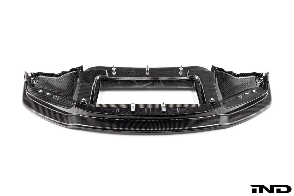 Alpha N G87 M2 Carbon Corse front splitter installed on a BMW M2, showcasing lightweight carbon fiber design on a white background.
