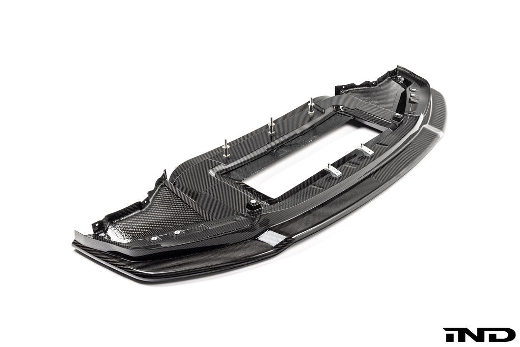 Alpha N G87 M2 Carbon Corse front splitter installed on a BMW M2, exterior car part with aerodynamic design and carbon fiber finish