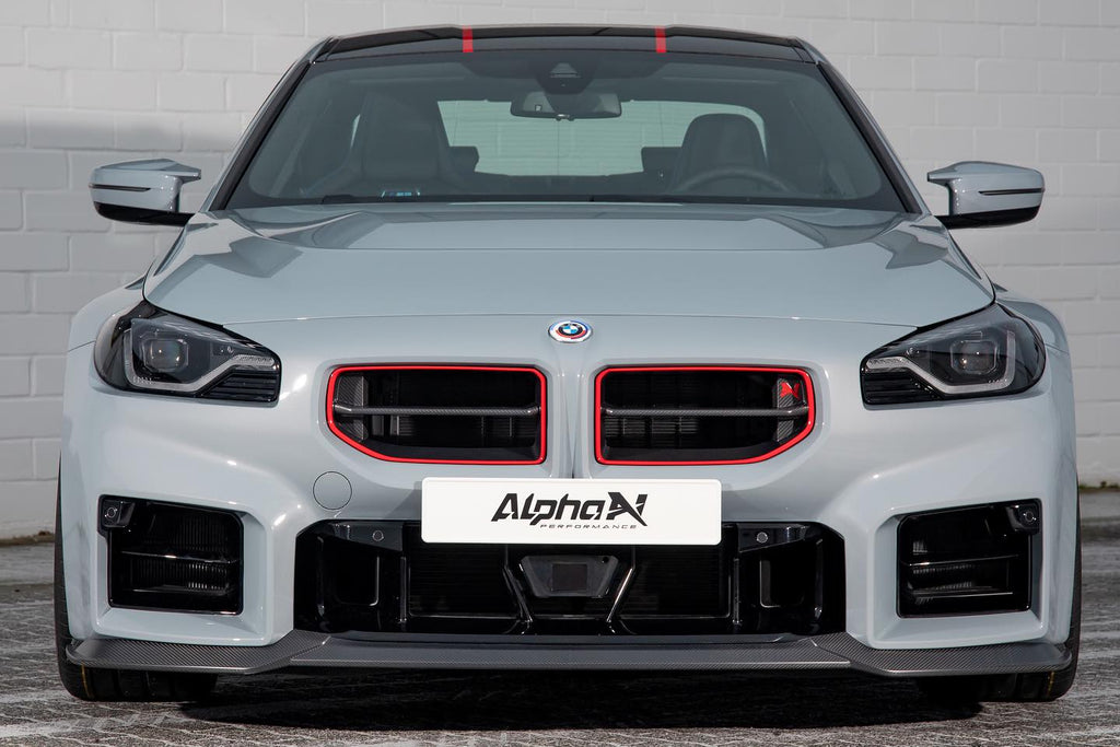 Alpha-N G87 M2 Carbon GT front lip installed on BMW M2, showcasing sleek aerodynamic exterior enhancement.