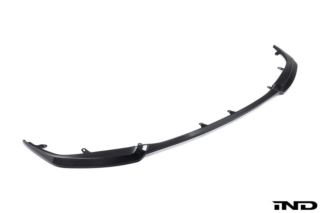 Alpha N G87 M2 Carbon GT front lip installed on a car, showcasing its sleek white finish and aerodynamic design for exterior enhancement.