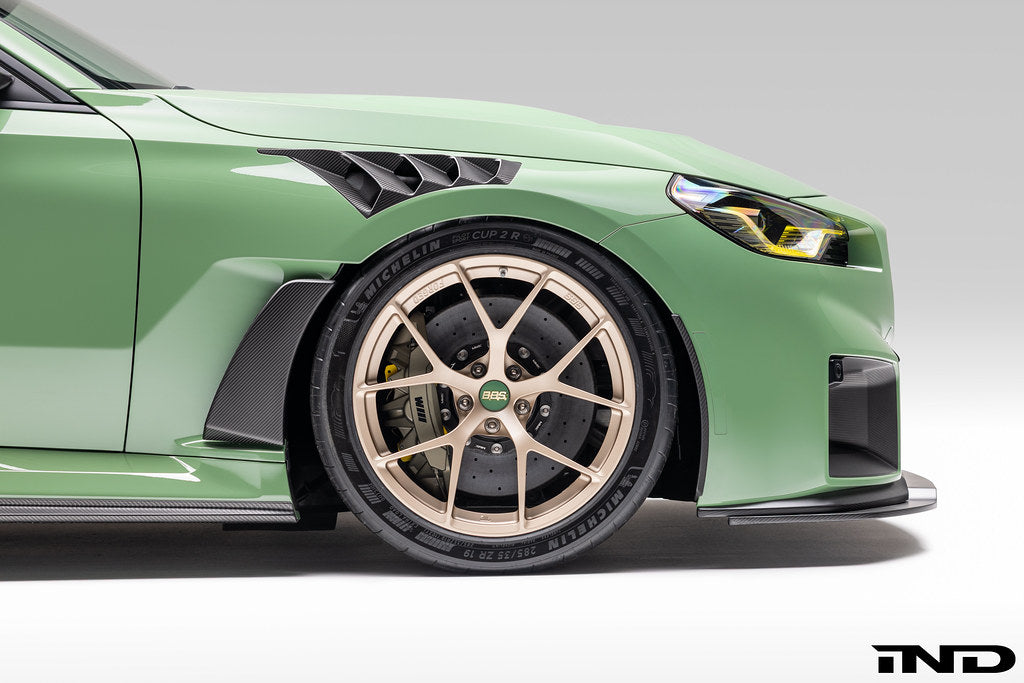 Alpha N G87 M2 Carbon Vented Front Fender Set V4 with Blades installed on vehicle, showcasing lightweight, aerodynamic exterior upgrade.