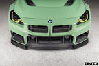 Alpha-N G87 M2 Carbon Corse front splitter installed, matte clear exterior car part for enhanced aerodynamics and style.