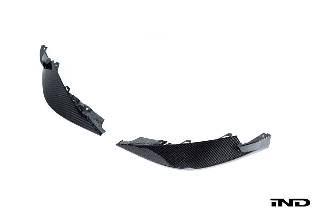 Alpha N G8X M3 M4 carbon front corner splitter set installed on a vehicle, showcasing the aerodynamic exterior enhancement.