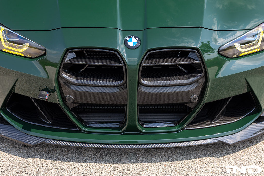 Alpha N G8X M3 M4 Carbon Front Grille installed on exterior of vehicle, showcasing sleek black design and precise fit.