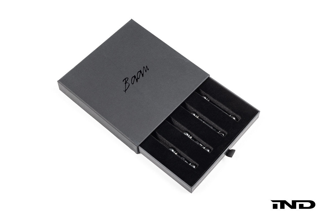 Baan Velgen G11 G12 7-Series Airmatic suspension lowering link set, white background, showing metallic components and installation details.
