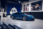 BBS FI-R Evo Porsche 911 GT3 centerlock wheel set with 20 and 21-inch diamond silver wheels installed on a car.