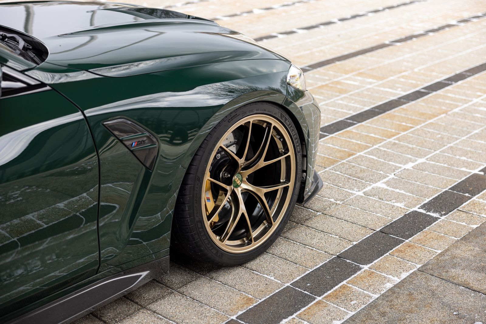 BBS G8X M2 M3 M4 RI-D 20-inch diamond gold wheel set installed on a vehicle, showcasing detailed wheel design.