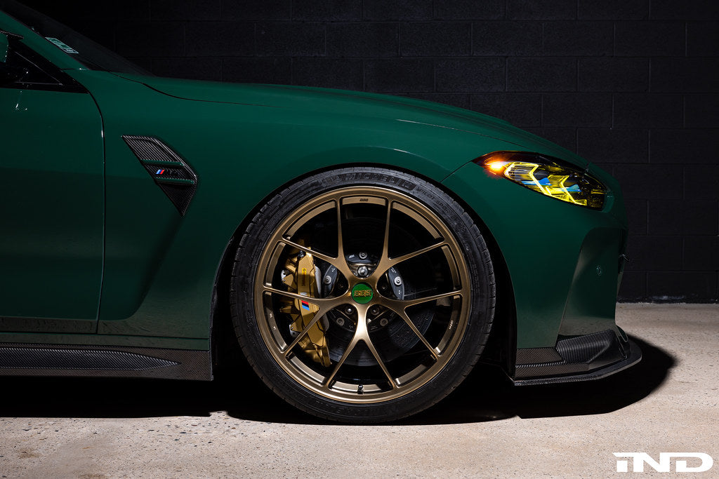 BBS G8X M2 M3 M4 RI-D 20-inch diamond gold wheel set installed on a vehicle, showcasing sleek, multi-spoke alloy wheels.