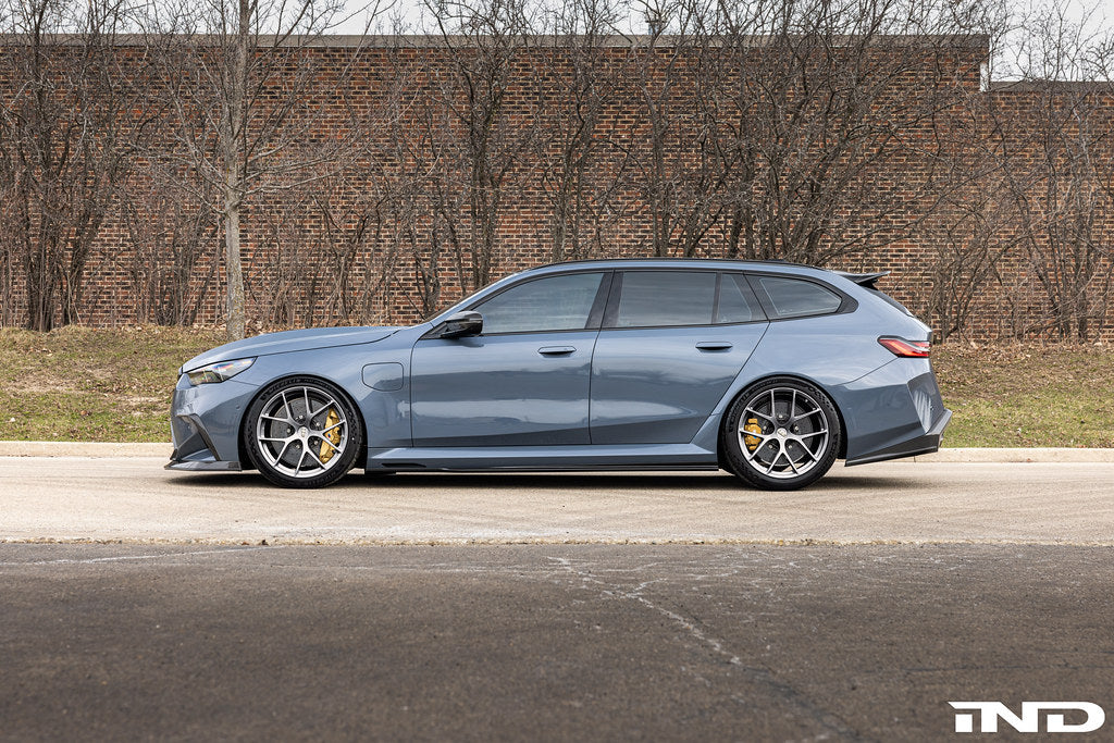 BBS G90 G99 M5 FI-R 21-inch wheel set installed on a vehicle, showcasing sleek alloy wheels with a modern multi-spoke design.