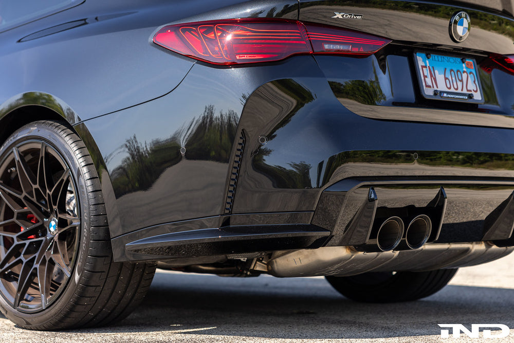 Black Sapphire BMW G82 M4 with Acexxon horizontal slat rear reflector inserts installed on rear bumper