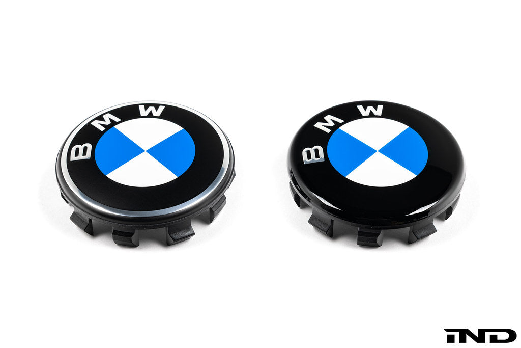 IND Gloss Black Wheel Center Cap Set for BMW, 56mm, featuring Next Dark Design, shown in a comparison image with standard caps.